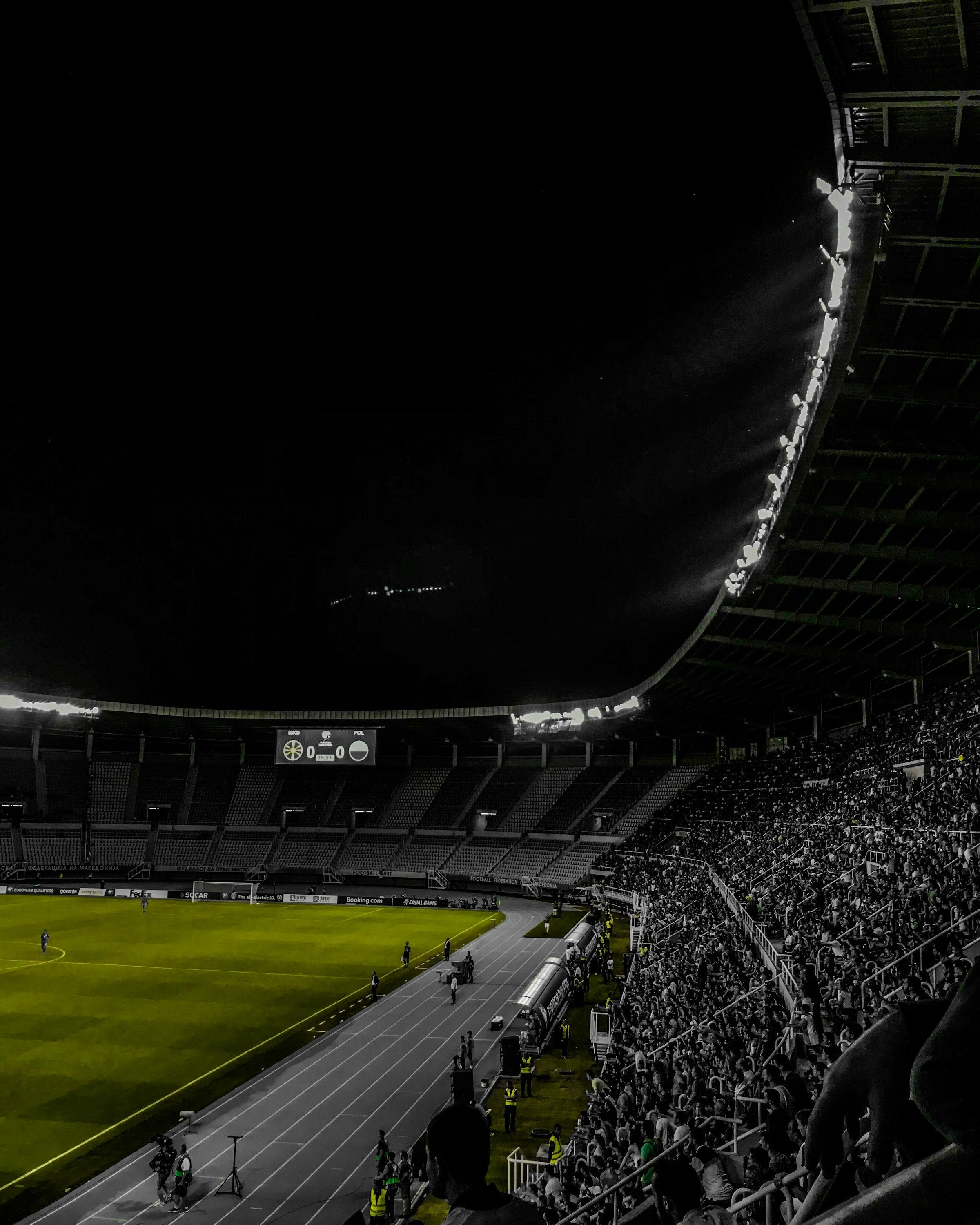 Dark stadium pitch under stadium lights — Clearance promo